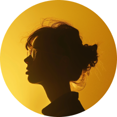 Round avatar profile picture of an artist featuring a silouhette on a yellow background.